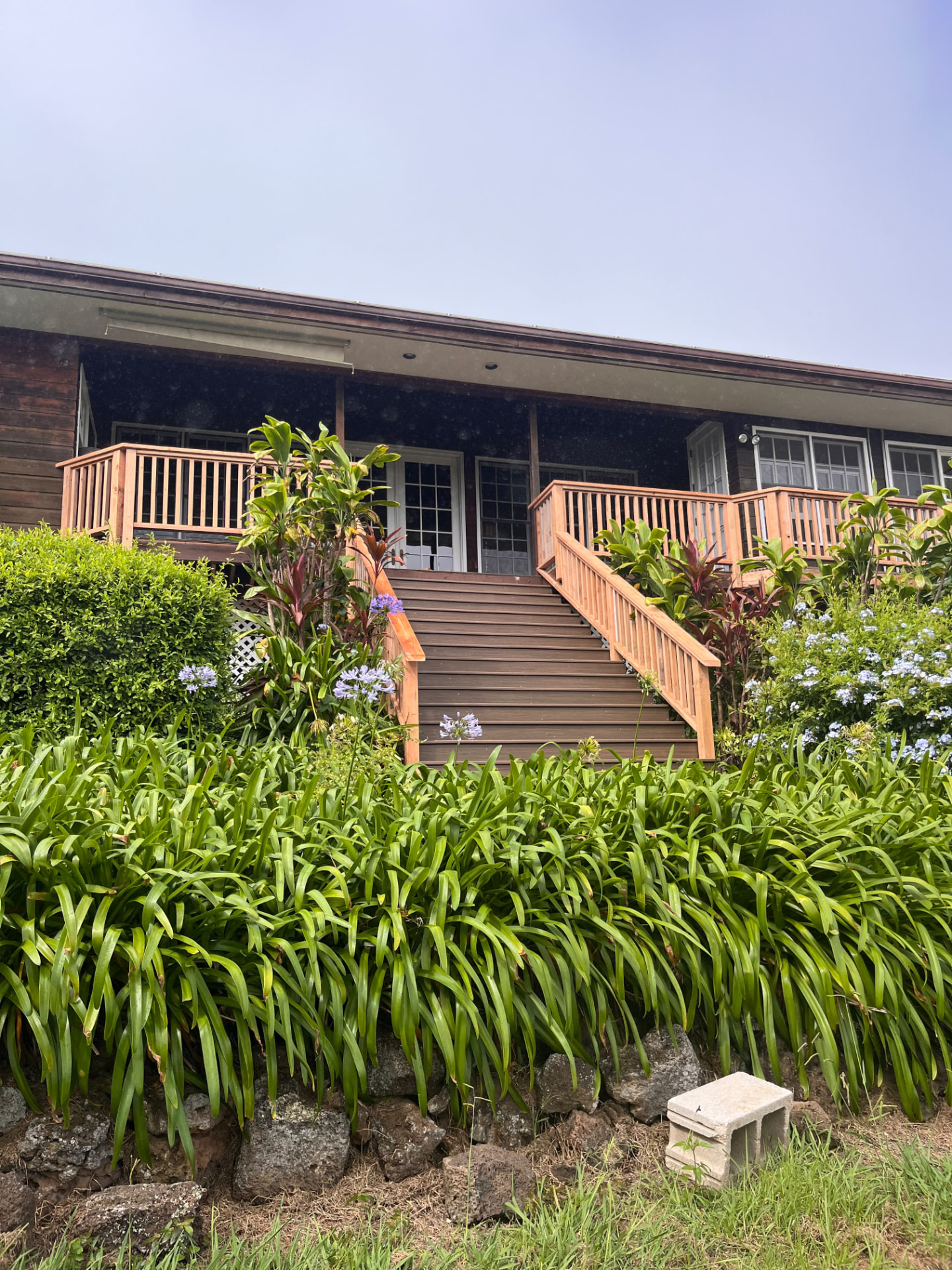 New deck stairs and redwood railings built on a North Hawaiʻi home